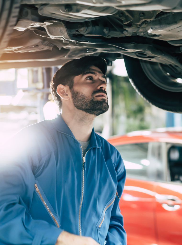 MOT Mechanic inspectin a vehicle - MOT Testing Telford